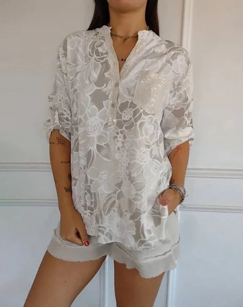 Blomstrende funklende bluse