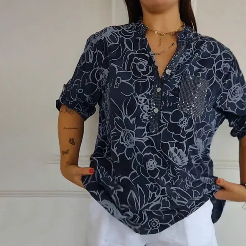 Blomstrende funklende bluse